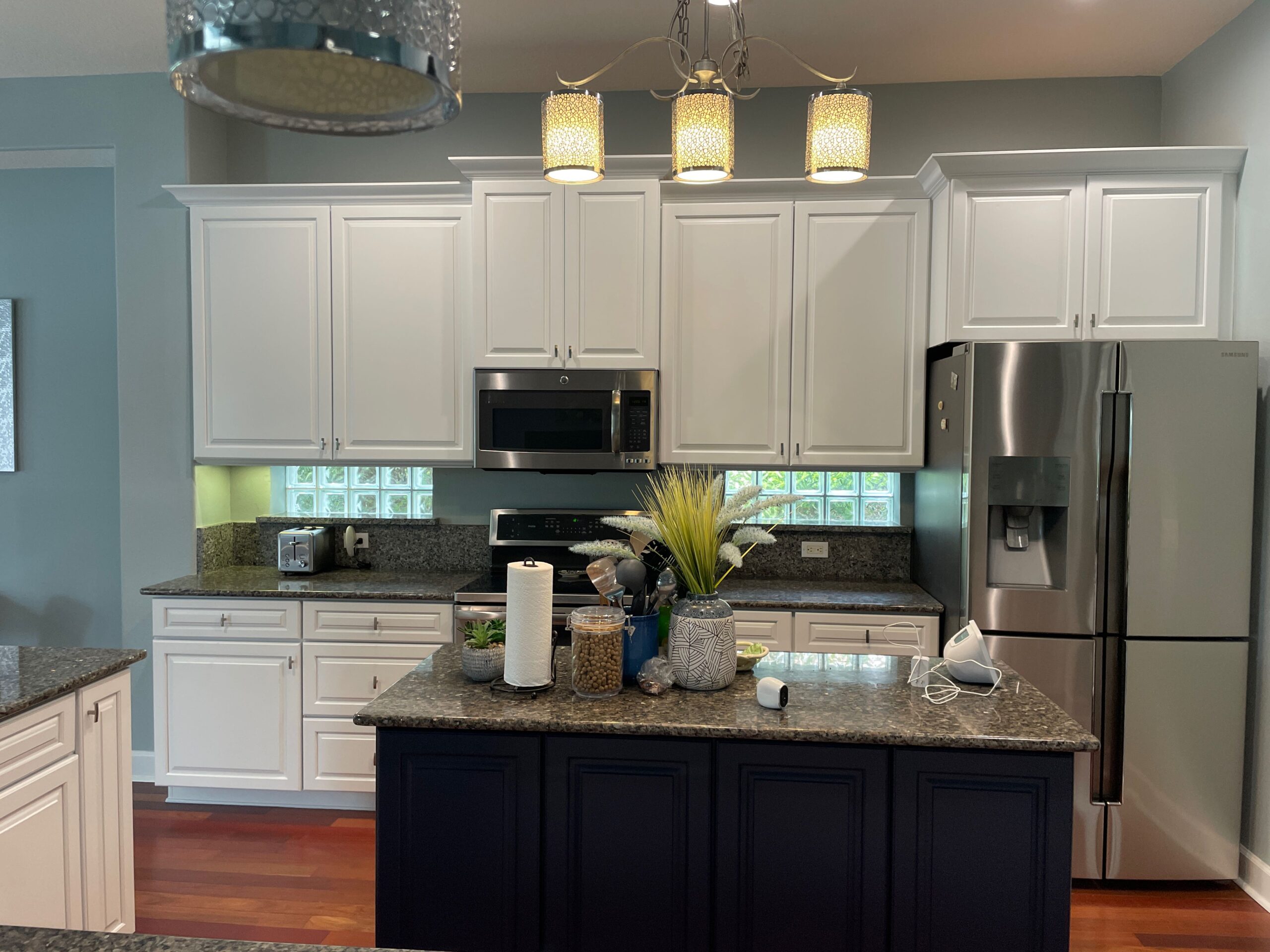 Professional painter working on home exterior in Lake Helen, FL